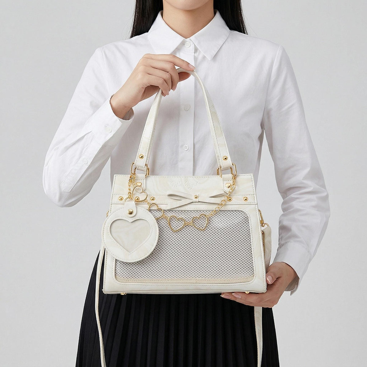 Sakura Dual Window Shoulder Ita Bag lifestyle view showing shoulder carry and front display areas
