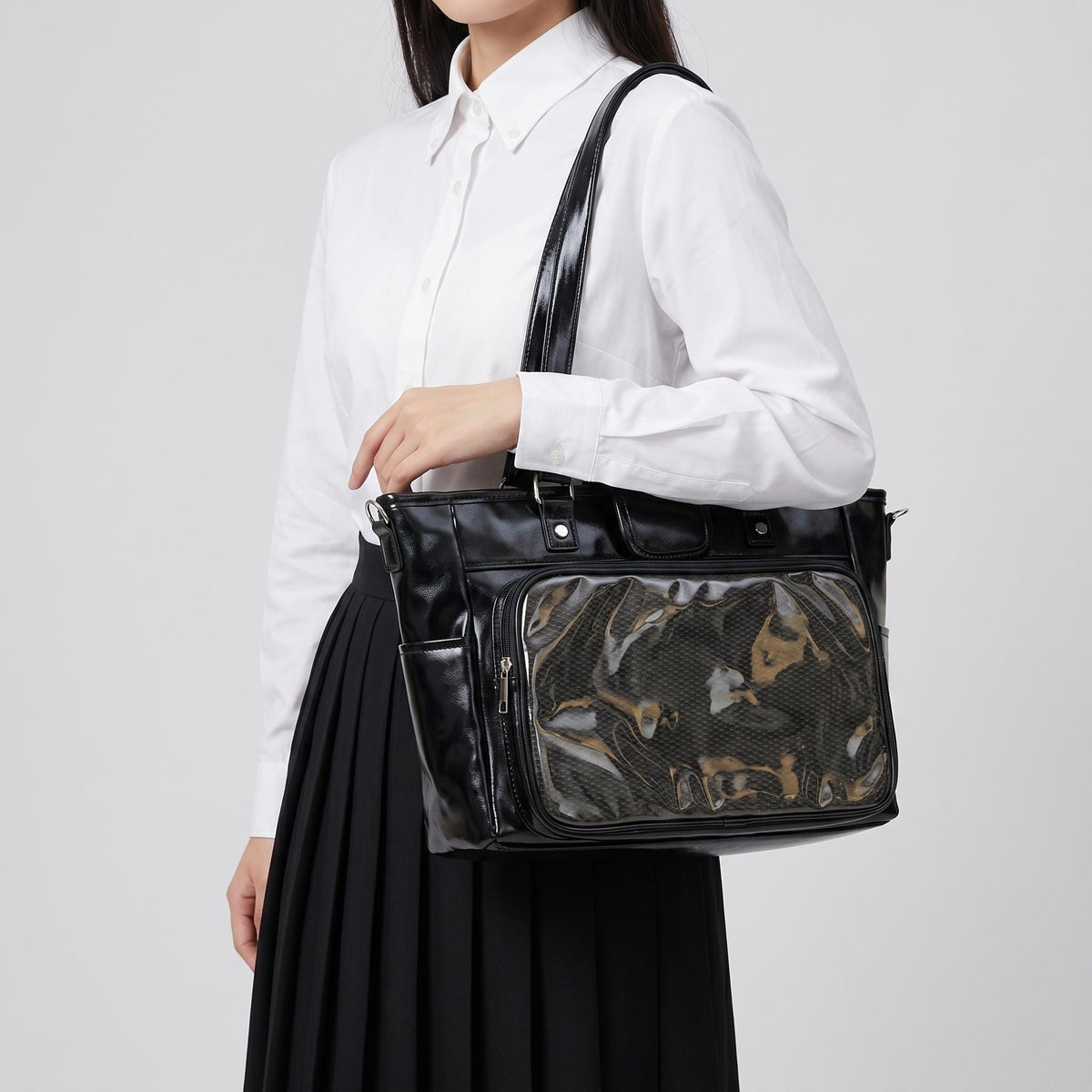 Hinata Wide Tote Ita Bag product detail view showing display frame and carrying hardware