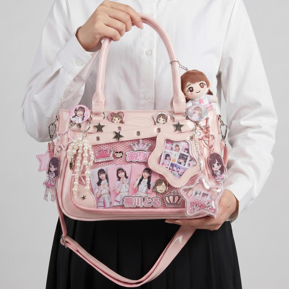 Yume Dual Window Shoulder Ita Bag front studio view showing rectangular display window, star hardware accents, and pearl charm