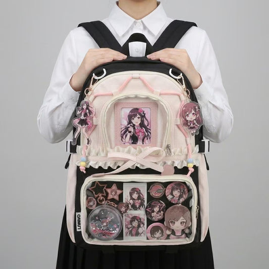 Furi Ruffle Dome Ita Backpack main product view showing ruffle trim and multiple clear display windows
